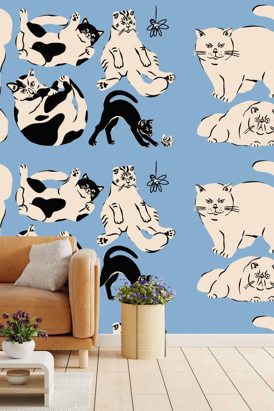 Children's room with blue cat wallpaper behind a small chair with plush octopus