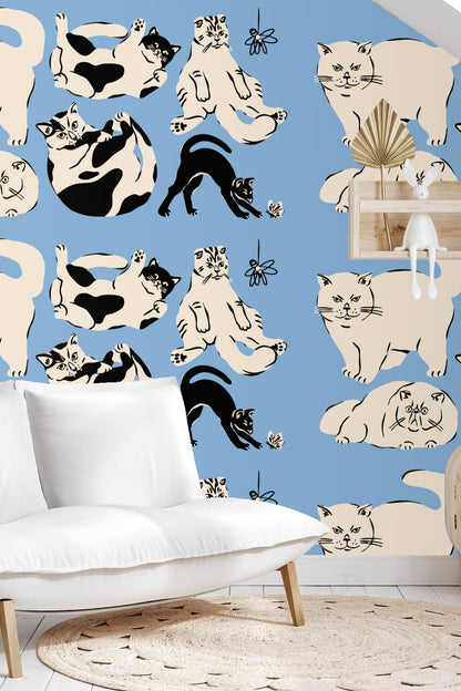 Cat lying on its back with black and white patches in wallpaper design