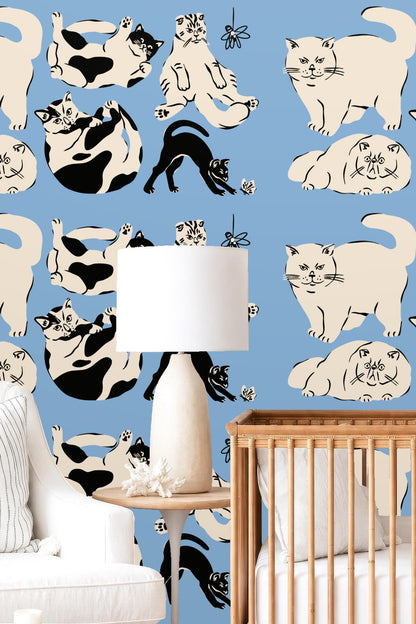Pattern repeat showing black and white cats side by side