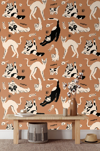 Bedroom with burgundy bed and sienna cat wallpaper
