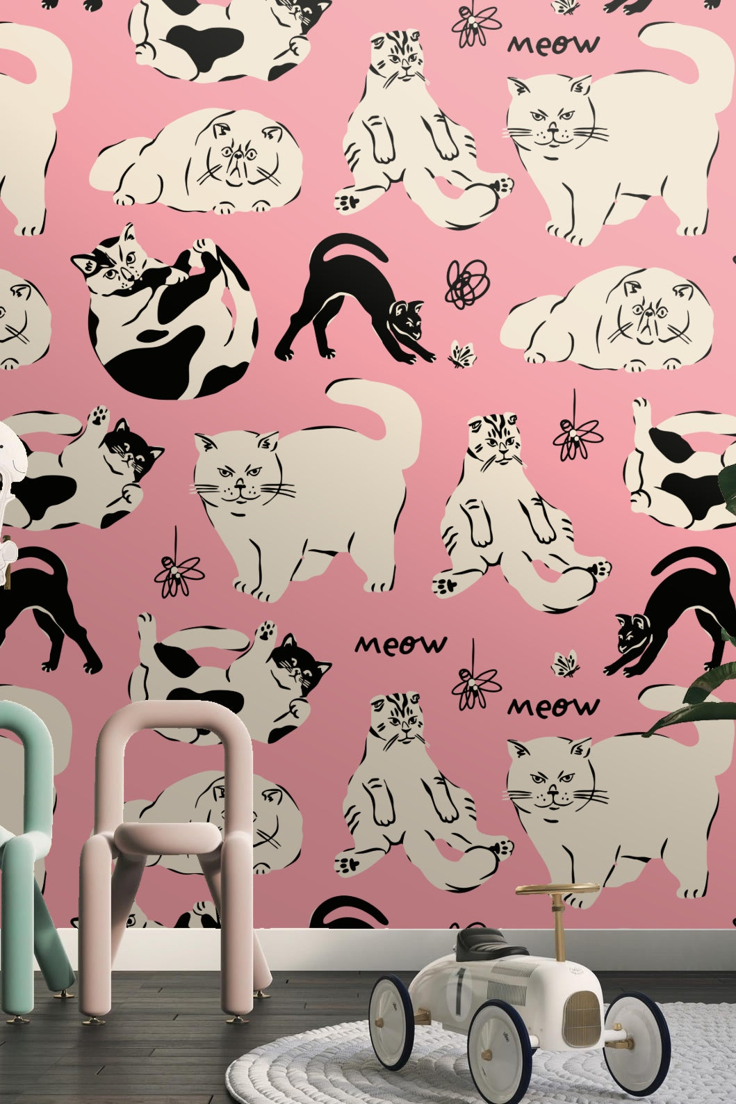Playfully drawn cat faces with expressive eyes on lively pink backdrop
