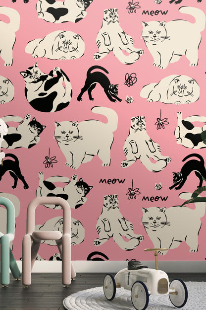 Playfully drawn cat faces with expressive eyes on lively pink backdrop
