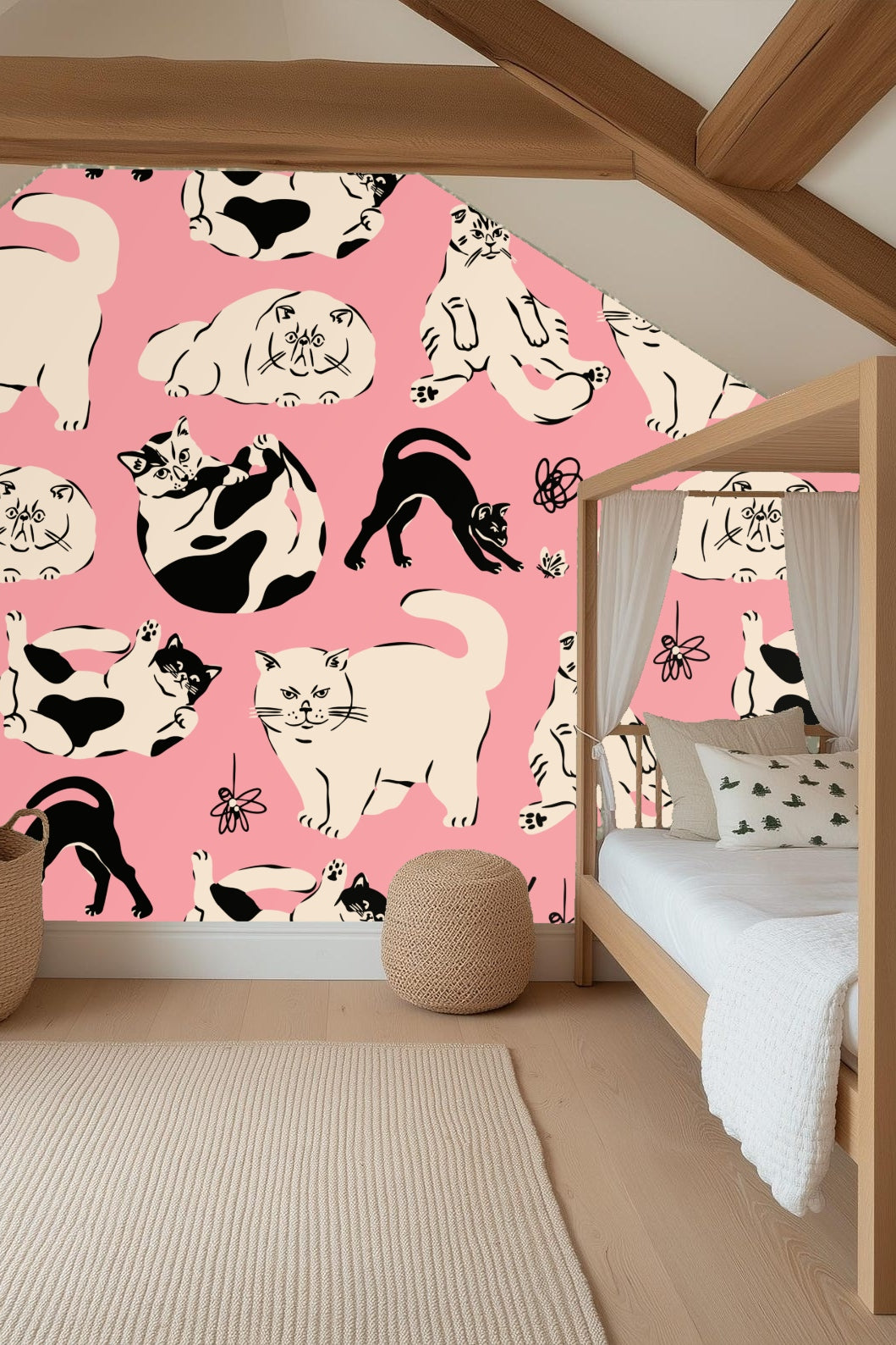 Detail of cream and black cats on pink wallpaper with handwritten 'meow'