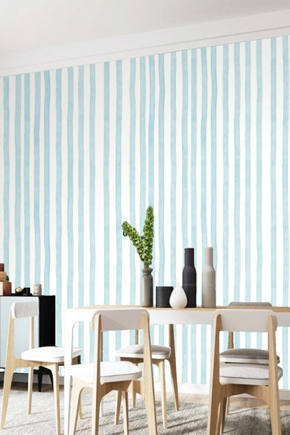 Modern room wall with rippled blue stripes wallpaper and clean white ceiling molding