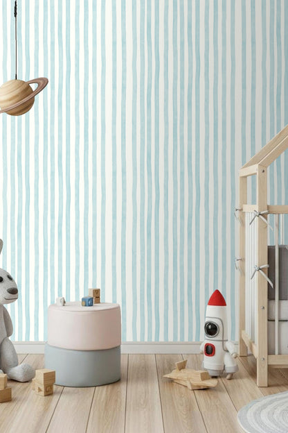 Natural light on pale blue vertical stripped wallpaper emphasizing texture