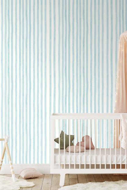 Contemporary interior scene showing vertical striped wallpaper with natural wood furniture