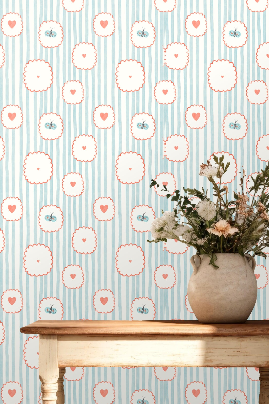 Original artwork detail showing blue vertical stripes with coral-outlined scalloped circles containing hearts and butterflies