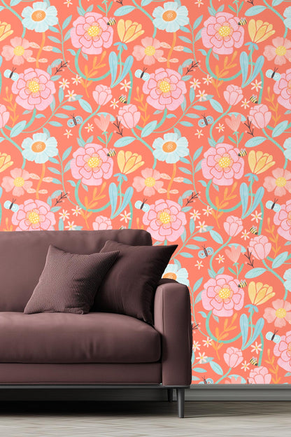 Bedroom featuring coral floral wallpaper behind white bed with light bedding