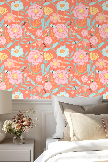 Room showing coral floral wallpaper behind oak dresser with round mirror