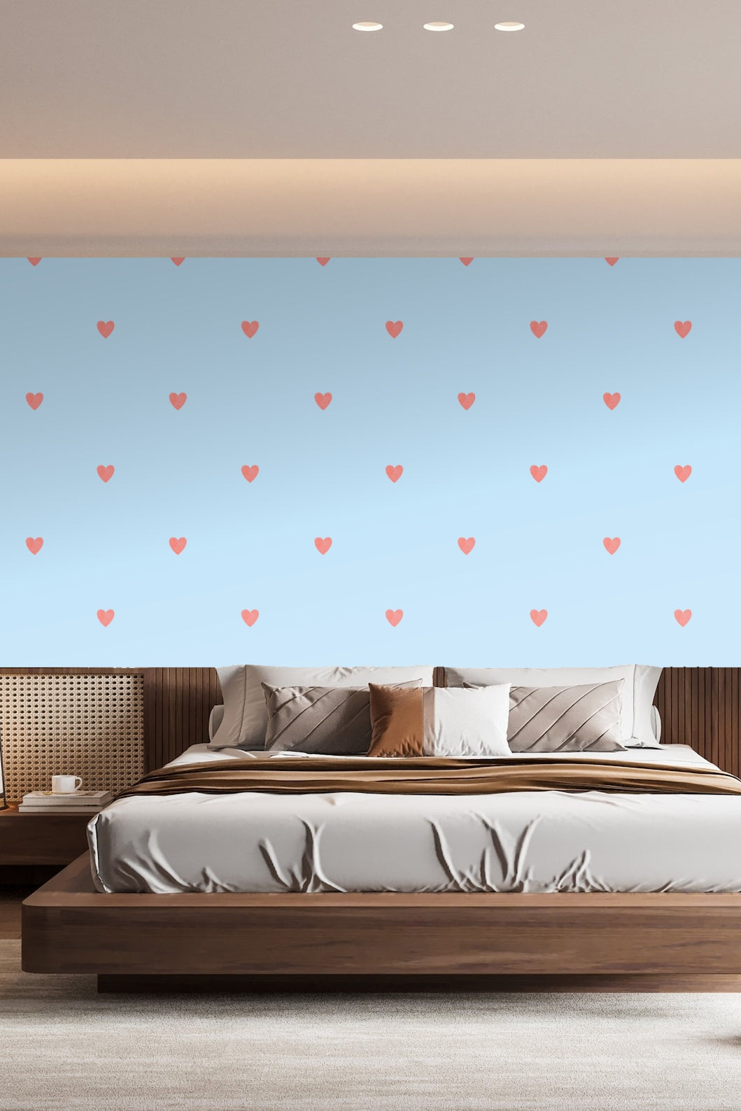 Powder blue wall with coral heart wallpaper behind a pile of white gift boxes