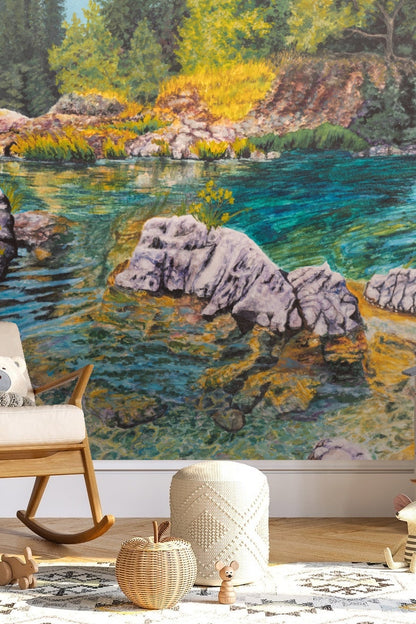 Wide angle view of pine forest bordering a calm blue river in painted wallpaper scene.