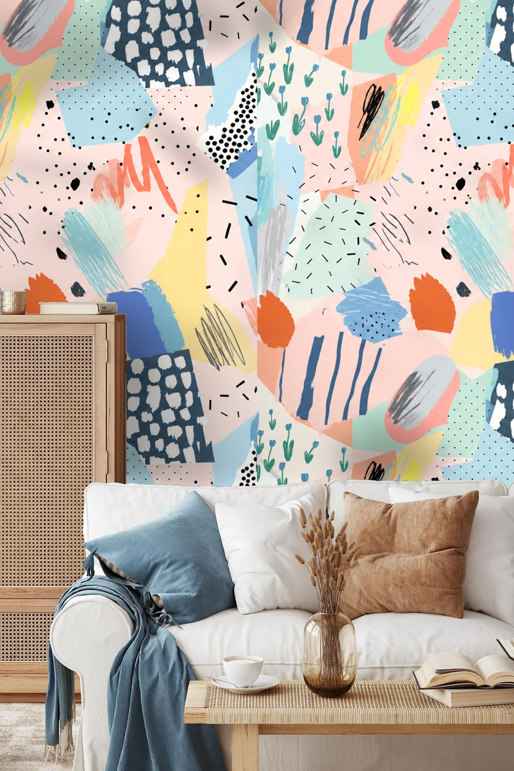 Bedroom scene featuring pastel mixed-media collage wallpaper behind white cushions, emphasizing softness and color
