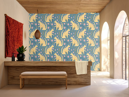 Close-up repeat of stylized saffron-yellow foxes and small pink flowers on a muted teal background