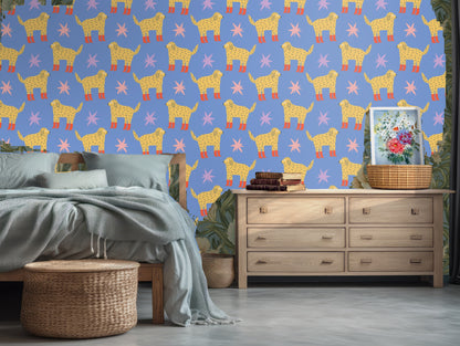 Detail of a single dog motif and nearby starburst showing hand-drawn texture and color contrast.