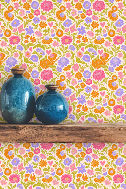 Furniture corner against Retro Pop Floral Tile wallpaper showing flow of leafy vines and flower clusters.