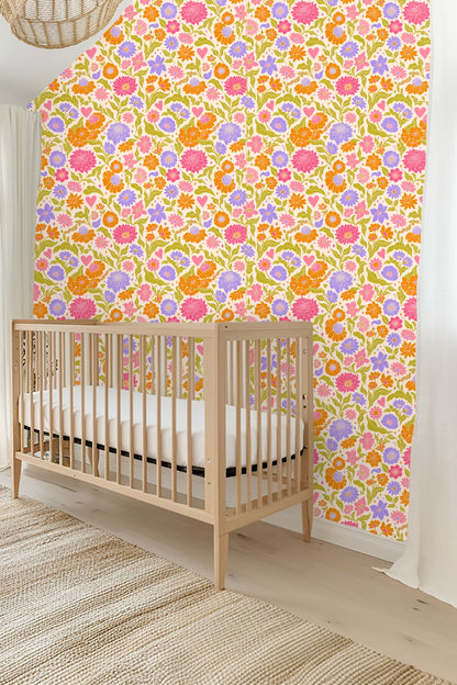 Bright bedroom wall covered in Retro Pop Floral Tile wallpaper showcasing colorful floral and heart motifs around a round mirror.