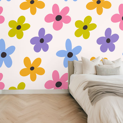 Nursery mockup with a natural wood crib in front of the colorful floral mural, demonstrating a playful kids' room application