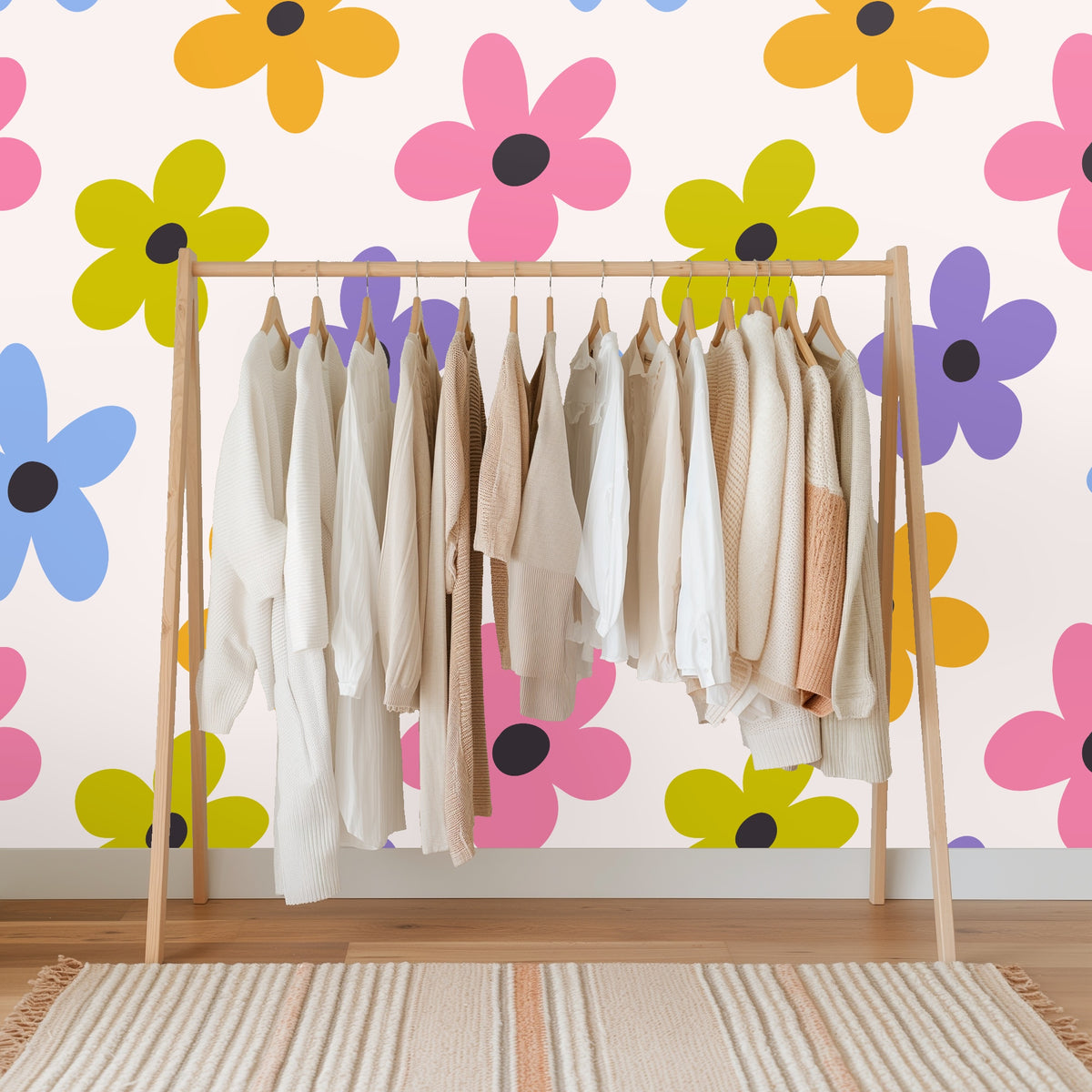 Full-room view of a vaulted bedroom wall covered edge-to-edge with the oversized posy pattern to show how it reads at large scale
