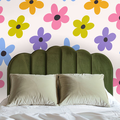 Blue velvet sofa placed in front of the floral wallpaper, illustrating the wallpaper as an energetic living-room accent wall