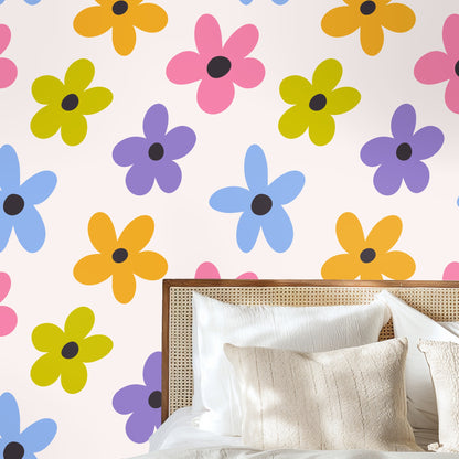 Cropped view of flowers around a bedside vignette to show color contrast and how the pattern frames furniture