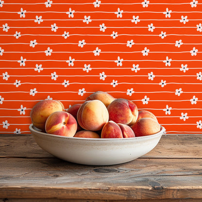 Pet nook: low shot of a dog bed against the wallpaper—playful floral motif livens a pet corner.