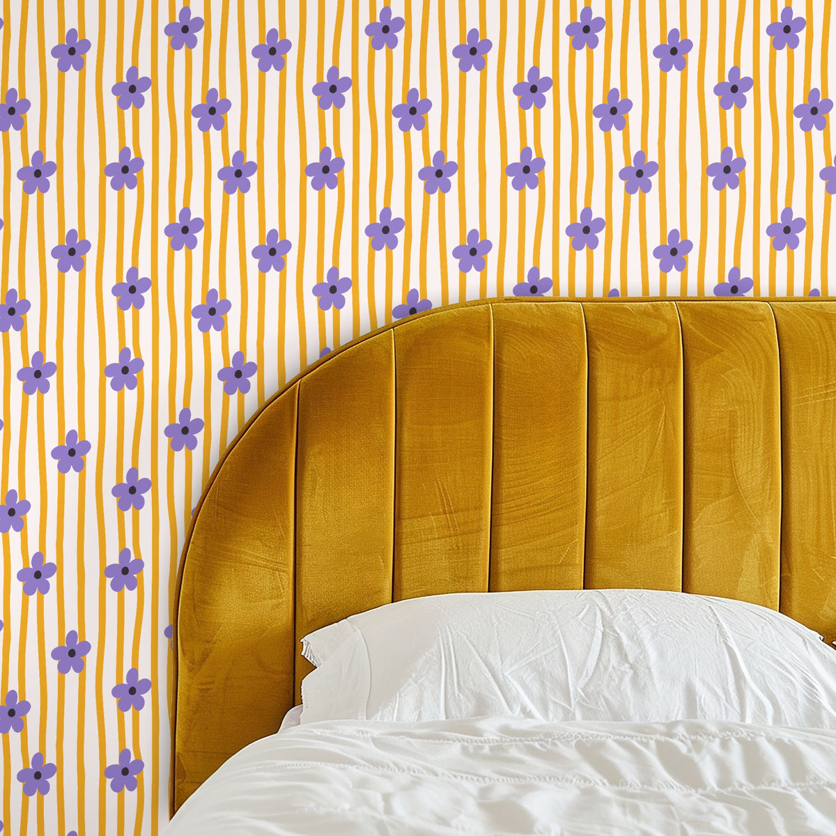 Close-up of the wallpaper pattern showing hand-drawn lavender five-petal flowers on narrow wavy saffron stripes over a warm cream background