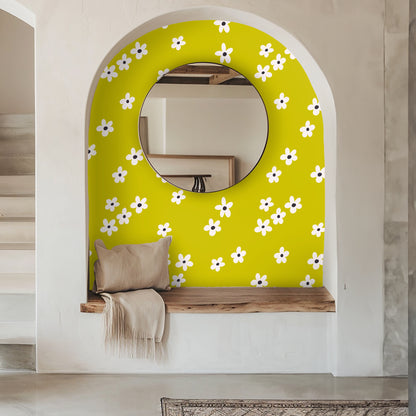 Open wooden medicine cabinet mounted on a wall covered with Citron Bloom wallpaper, showing toiletries on the shelves.