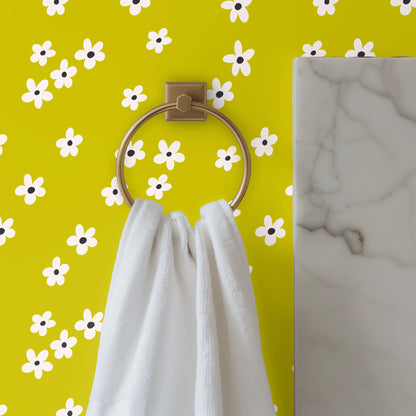 Detail view of Citron Bloom pattern scaled across a wall—flowers spaced in a loose, scattered repeat.