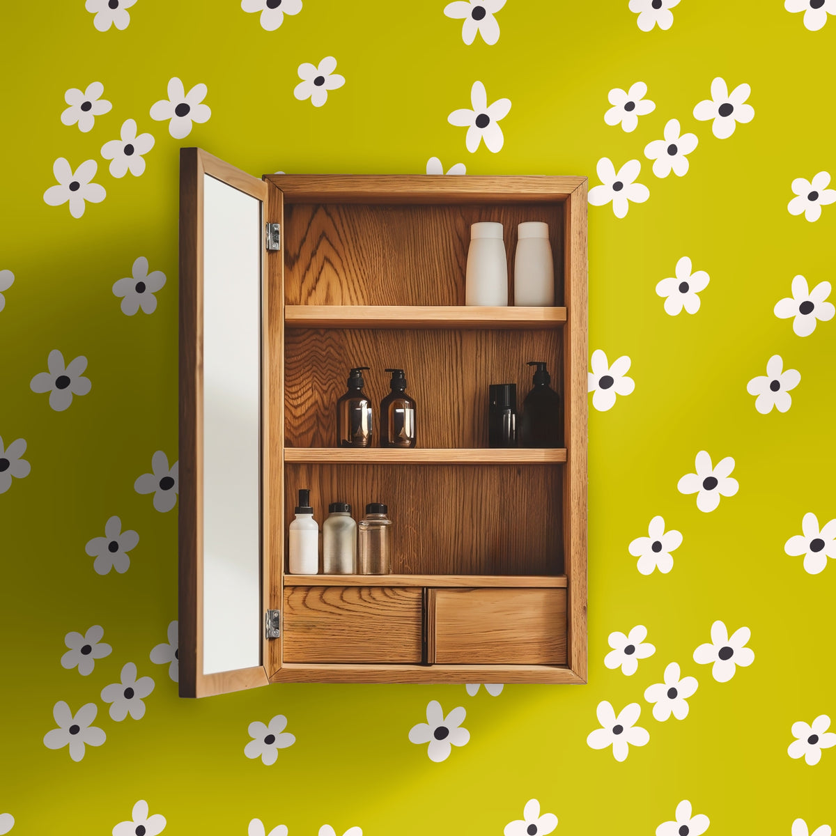 Laundry room with front-load washer and dryer, wood countertop and Citron Bloom wallpaper behind a window and floating shelves.