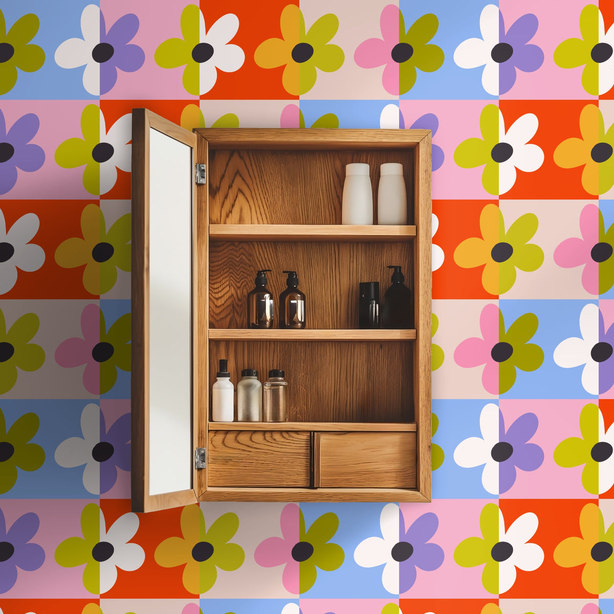 Bathroom cabinet open against a Patchwork Bloom wall, showing a close crop of the checkerboard daisies around a wooden medicine cabinet.