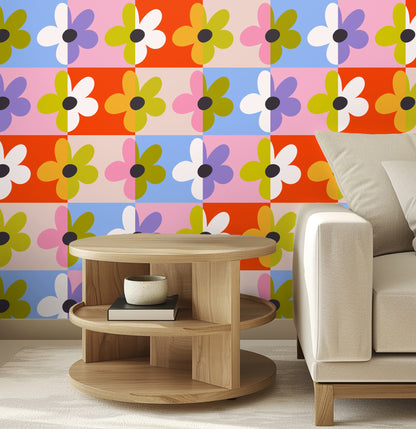 Close-up of the Patchwork Bloom pattern showing oversized daisies on alternating coral, blue and pink tiles with olive petals and charcoal o