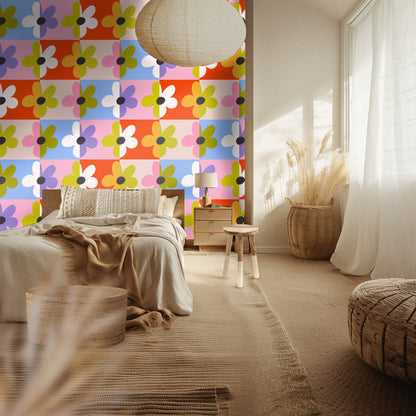 Neutral bedroom with Patchwork Bloom as a headboard wall; the bold pattern contrasts with natural linens and woven textures.