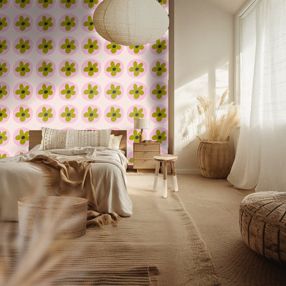 Styled bedroom with a green upholstered bedframe and Petal Orbit wallpaper covering the full accent wall behind the bed.
