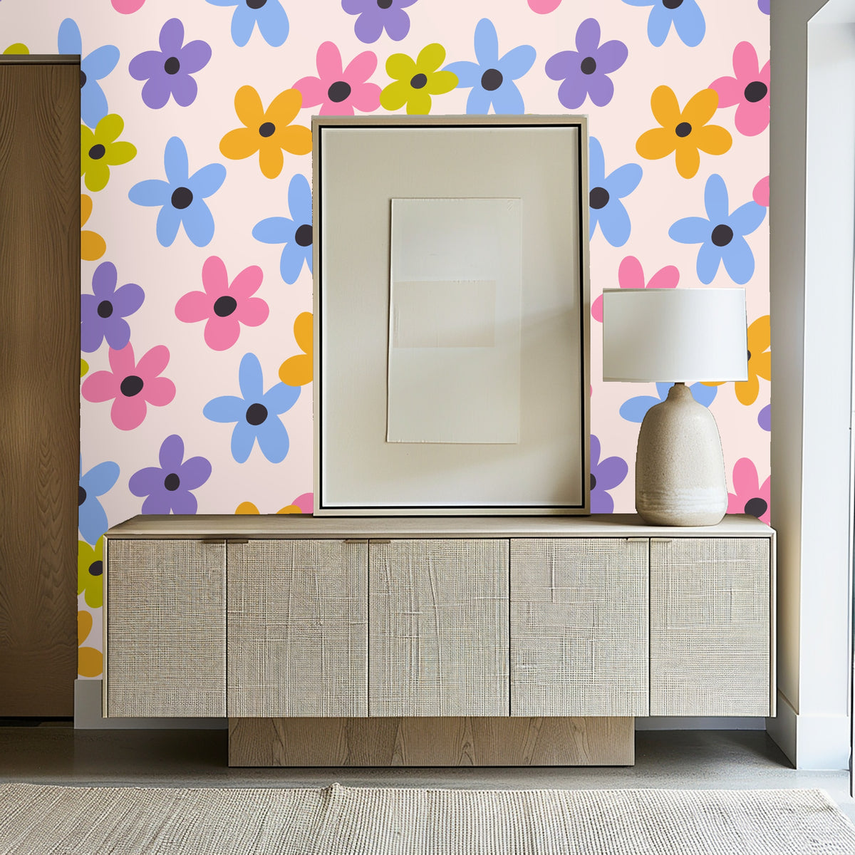 Detail shot of wallpaper behind a mirror and dresser, showing scale of the floral repeat near decor objects.