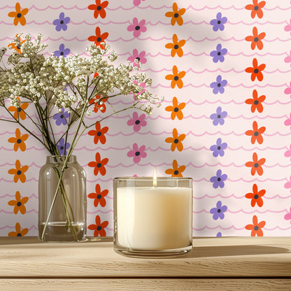 Wallpaper behind a mustard velvet channel-tufted headboard; Ripple & Bloom pattern creates a lively bedroom backdrop