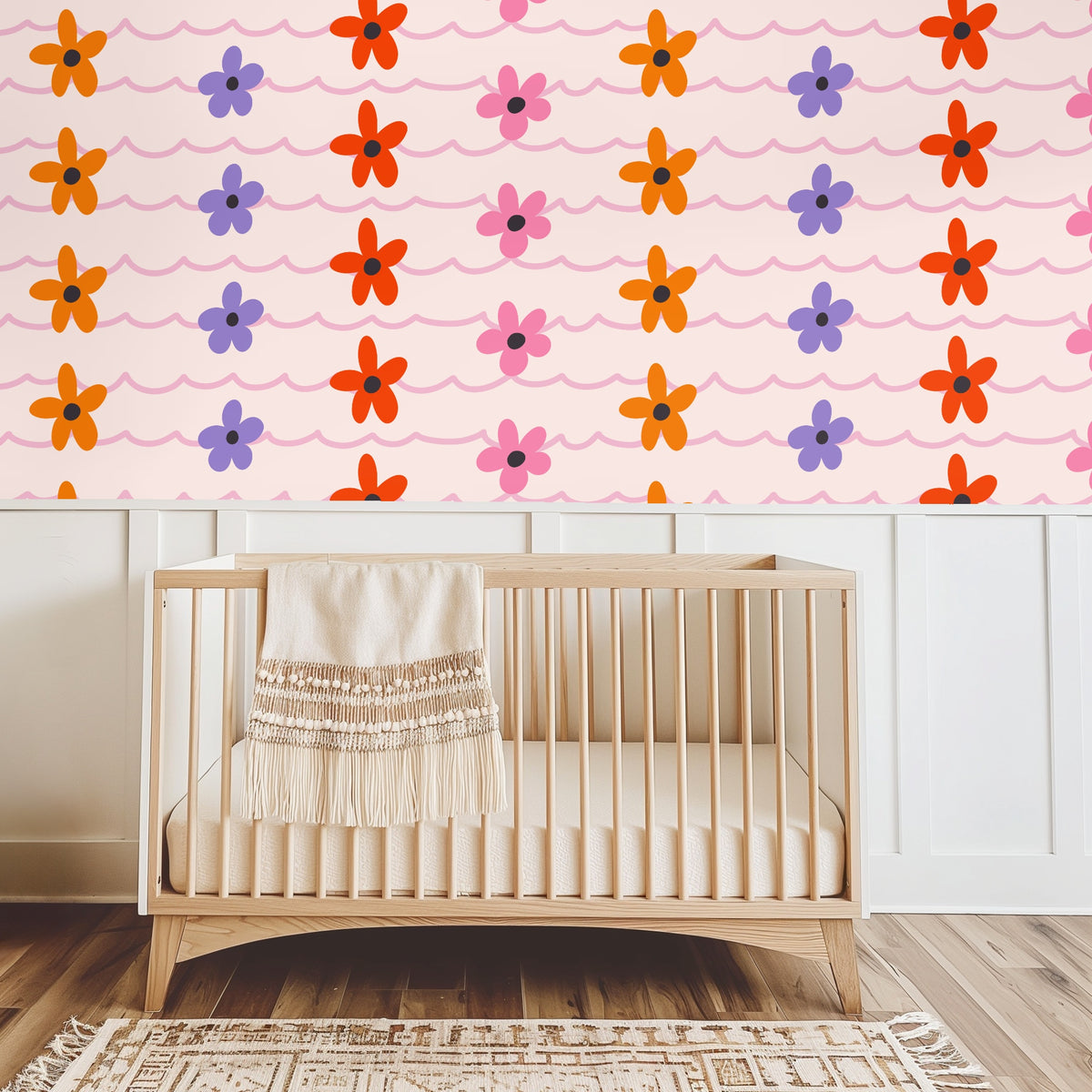 Close view of a dresser vignette with baby's-breath and candle in front of the wallpaper, emphasizing small-to-medium repeat