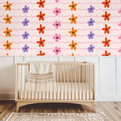Close view of a dresser vignette with baby's-breath and candle in front of the wallpaper, emphasizing small-to-medium repeat