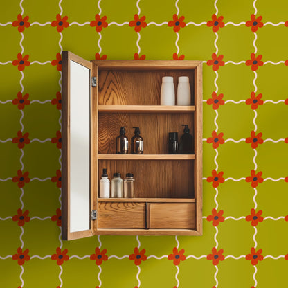 Laundry room wall above washer and sink finished with Marigold Lattice wallpaper beside a window