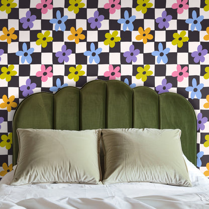 Styled scene with a blanket ladder against Petal Check wallpaper, showing the scale of the floral-and-check repeat next to a neutral throw