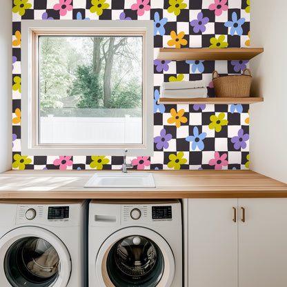 Bathroom view with a wooden medicine cabinet mounted on Petal Check wallpaper showing colorful flowers over the checkerboard field