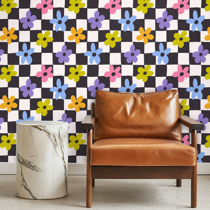 Full-height shot of Petal Check wallpaper on a wall next to wood floors and simple baseboard, showing overall repeat and scale