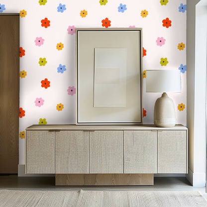 Styled tabletop with flowers and the wallpaper in soft focus, emphasizing the playful, modern floral shapes