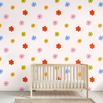Full pattern repeat of Petite Posy: small graphic flowers in red, pink, blue, mustard and olive on a pale blush background