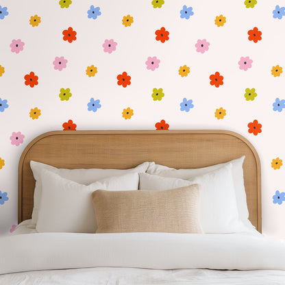 Detail view of the pattern repeat showing single-color petal shapes and small charcoal centers