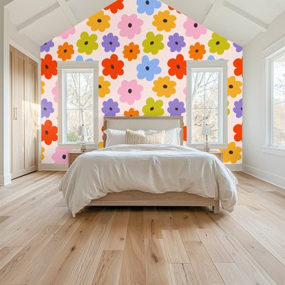 Bedroom headboard scene with a scalloped green headboard against the oversized daisy repeat
