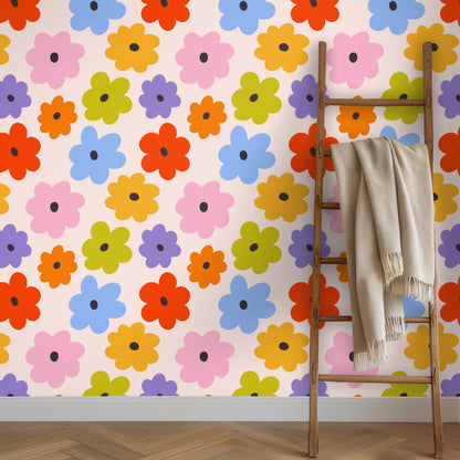 Arched entryway lined with the floral wallpaper, pattern wrapping a tall wall around the doorway