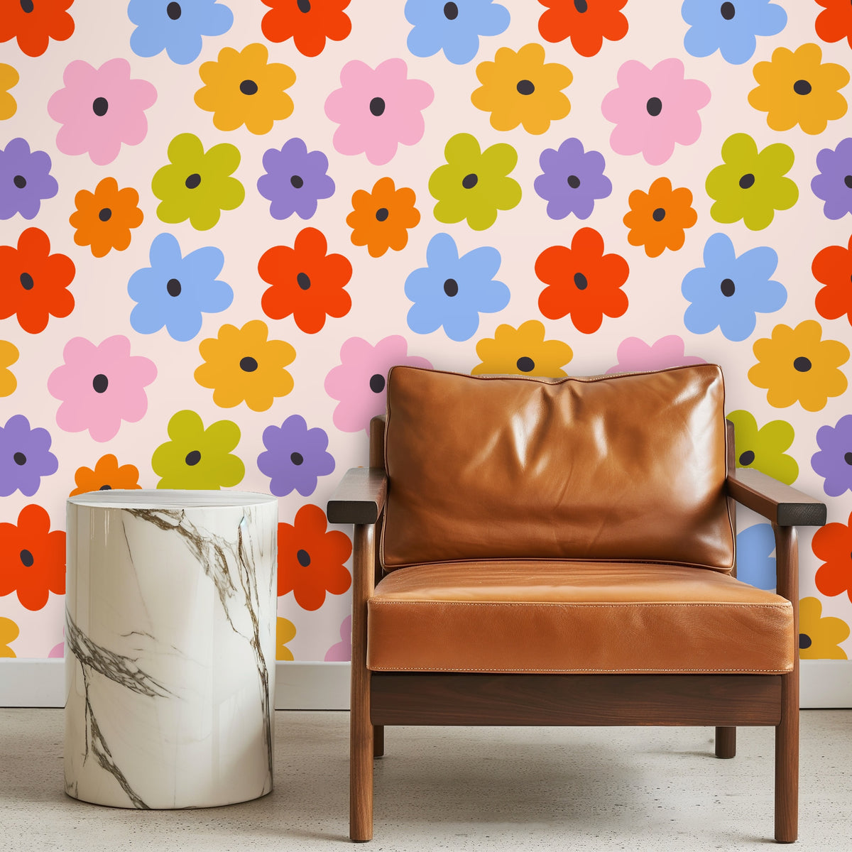 Living room vignette with an orange sofa and large floral repeat wallpaper as an accent wall