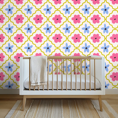 Wide nursery view with a light-wood crib and the wallpaper as a bold statement wall