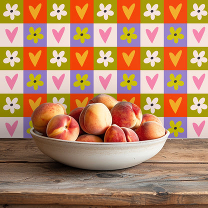 Wide living-room shot with an orange sofa set against a full wall of the Sweet Love Grid pattern