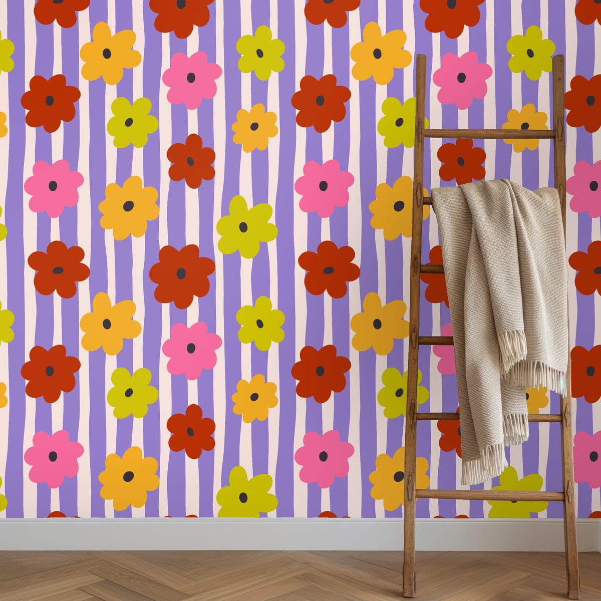 Wall detail showing the repeat and color interplay—hand-drawn lavender stripes, soft blush bands, and bold flat-colored flower shapes.